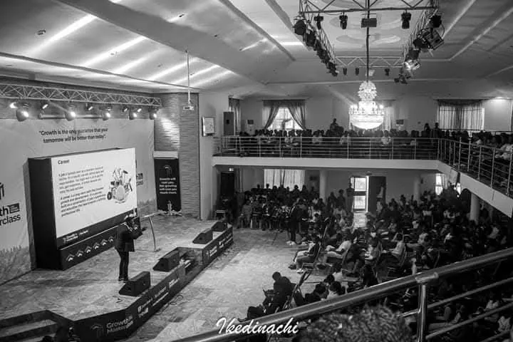 Addressing a packed auditorium at a leadership conference